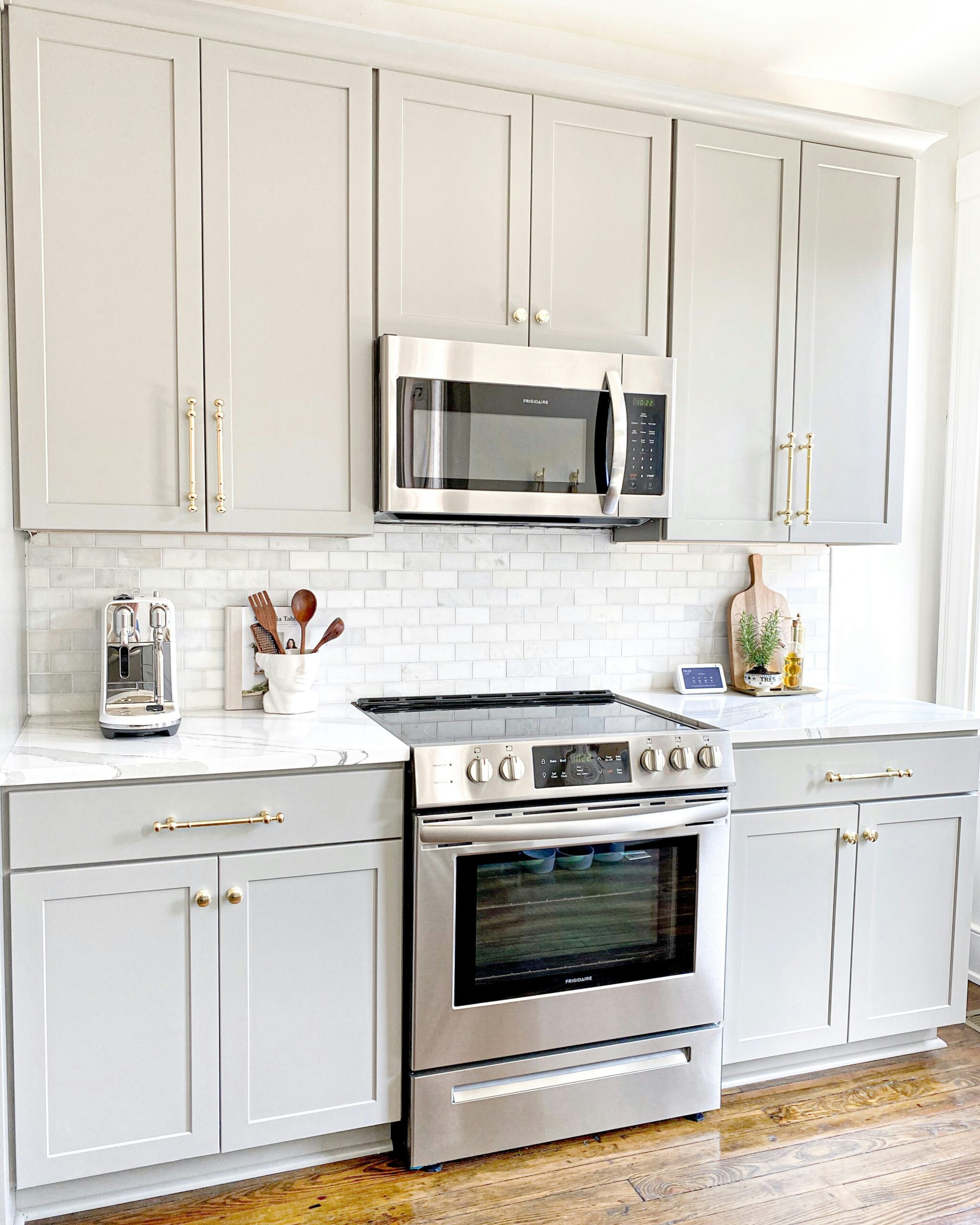 Modern kitchen with newly painted cabinets and backsplash